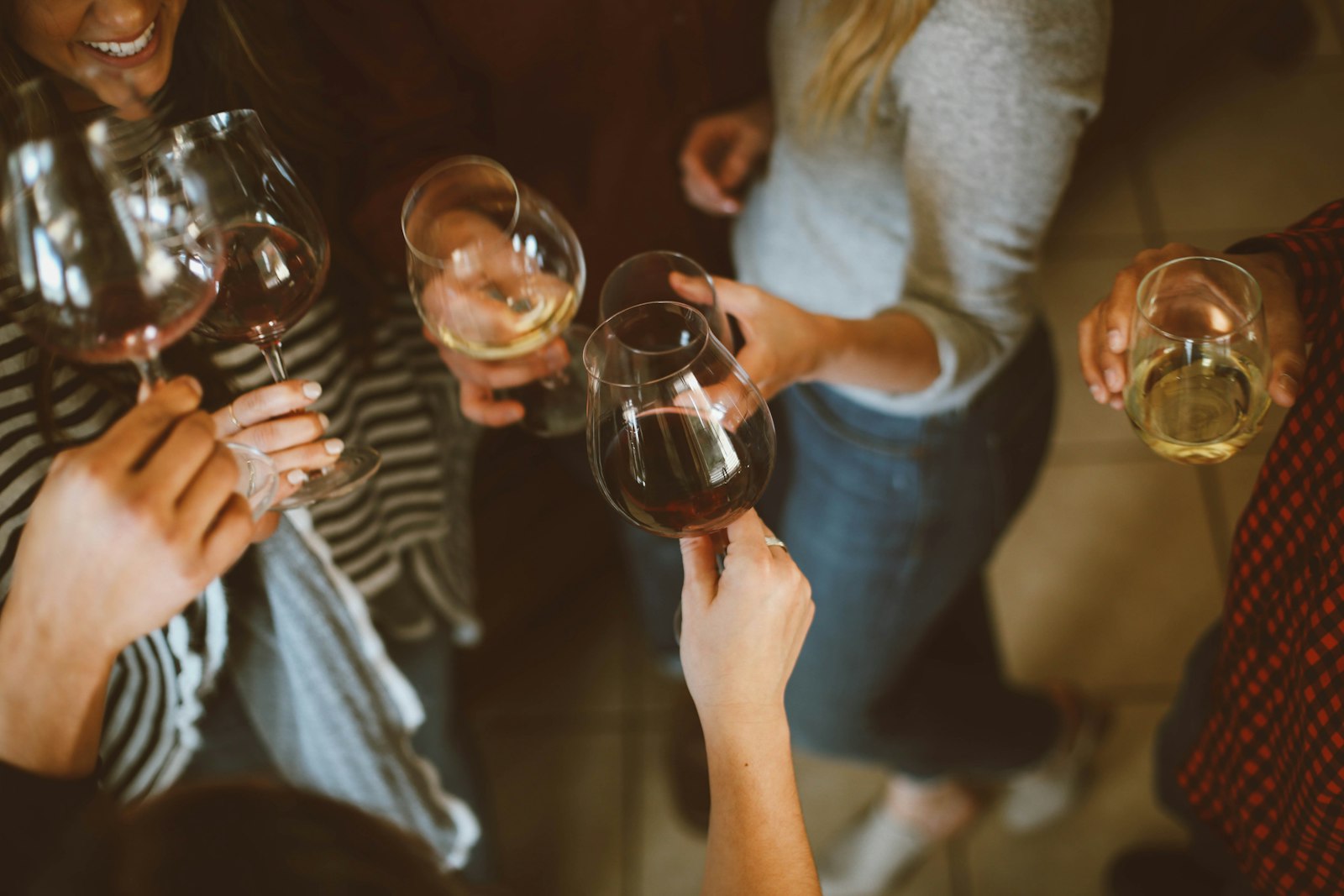 Guests raising glasses over the dance floor