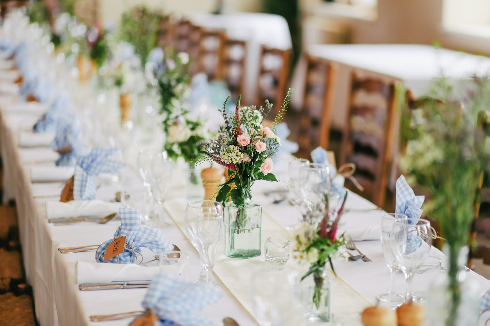 The reception table set with wildflowers